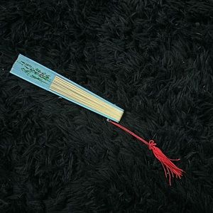 A pretty fan with. design when opened up